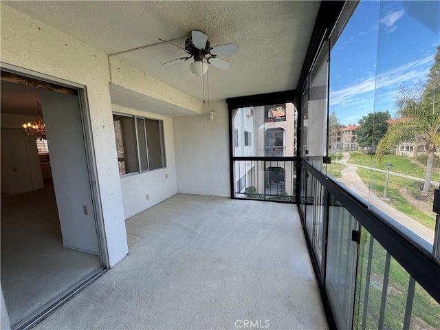 balcony featuring ceiling fan