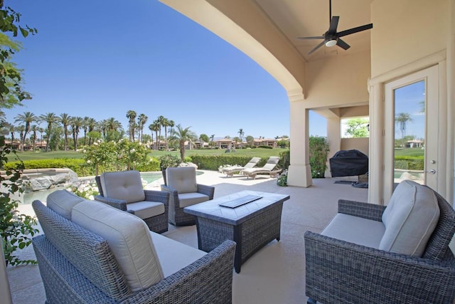 view of patio with ceiling fan, a grill, and an outdoor living space