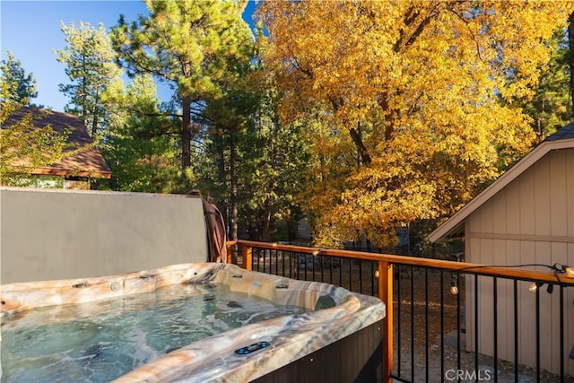 deck featuring a hot tub