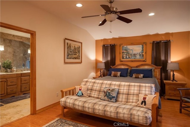 bedroom with light wood-type flooring, ceiling fan, and lofted ceiling