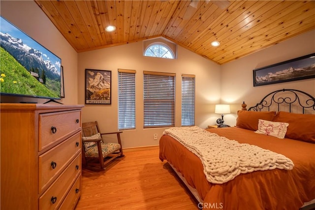 bedroom with light hardwood / wood-style flooring, lofted ceiling, and wood ceiling