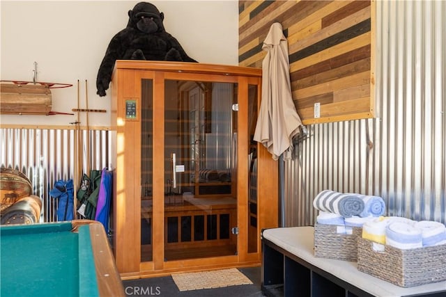 mudroom featuring wood walls and pool table