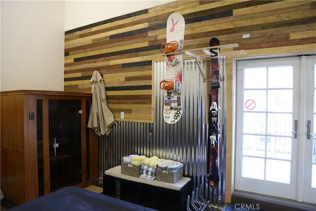 mudroom with wooden walls