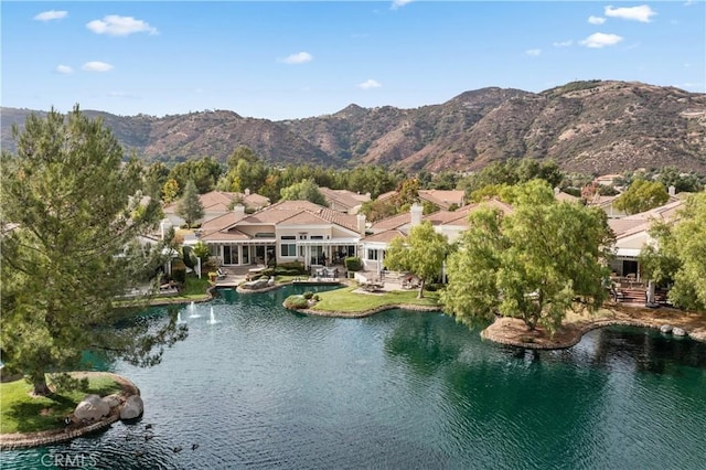 bird's eye view featuring a water and mountain view