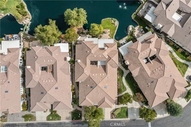 drone / aerial view with a water view