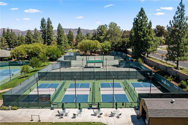 view of sport court with a mountain view