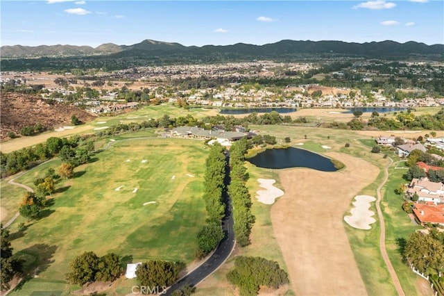 birds eye view of property featuring a water and mountain view