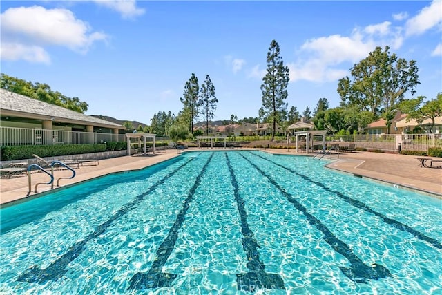 view of swimming pool featuring a patio