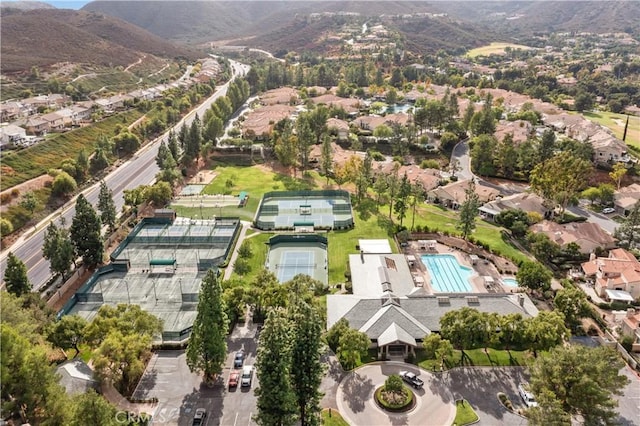 birds eye view of property featuring a mountain view