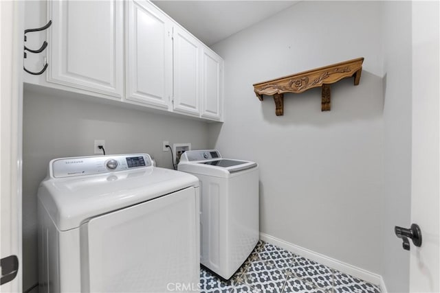 laundry area with cabinets and independent washer and dryer