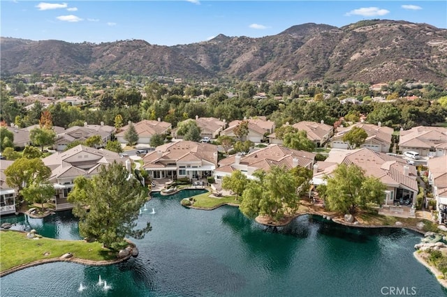 bird's eye view featuring a water and mountain view