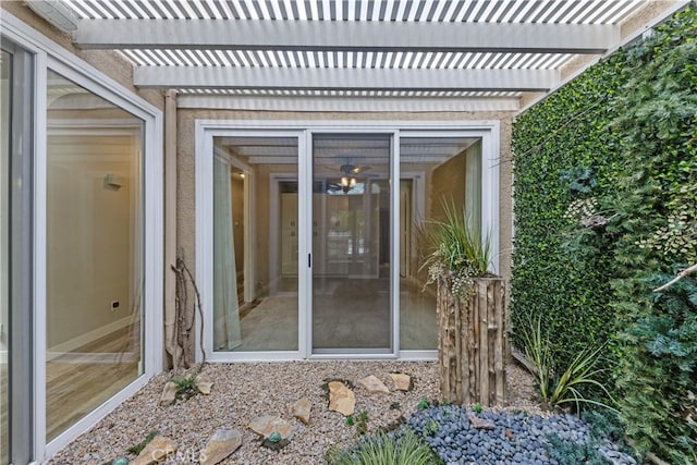 entrance to property with a pergola