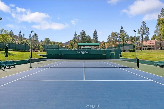 view of sport court featuring basketball hoop