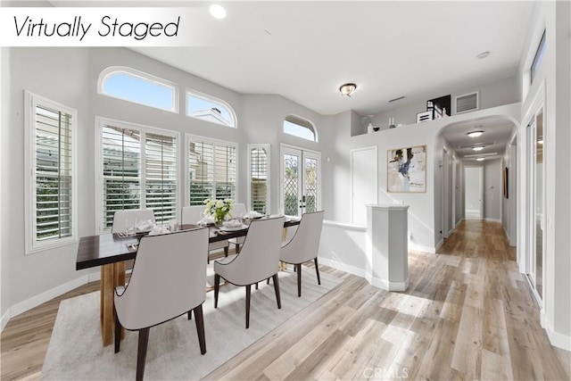 dining space featuring plenty of natural light and light wood-type flooring