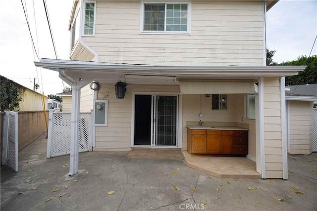 rear view of property featuring a patio area