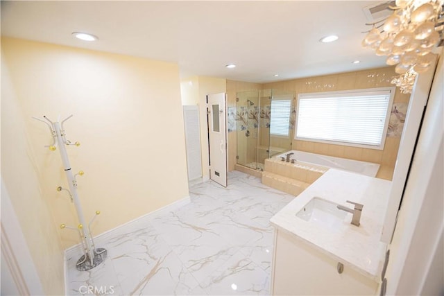 bathroom featuring vanity and independent shower and bath