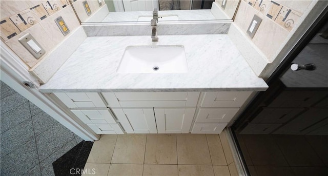 bathroom with tile patterned flooring and sink