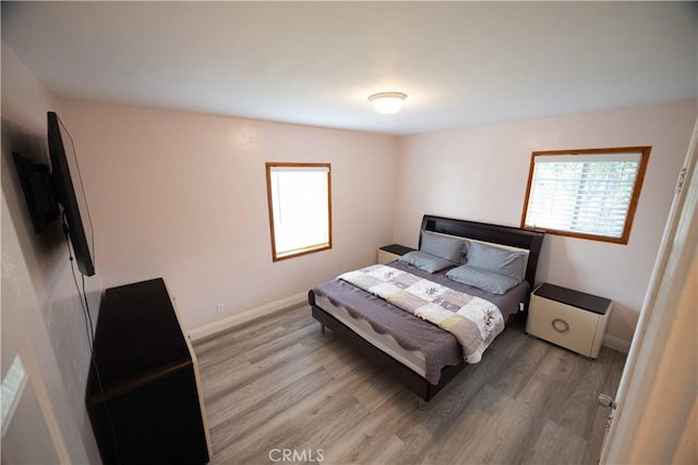 bedroom with light wood-type flooring