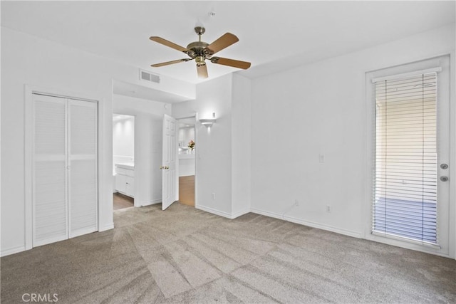 interior space with ceiling fan