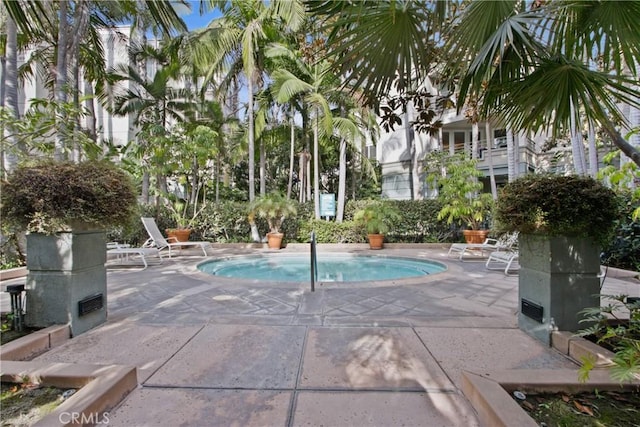 view of swimming pool featuring a patio area