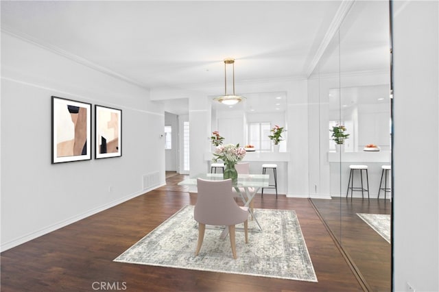 living room featuring crown molding and dark hardwood / wood-style floors