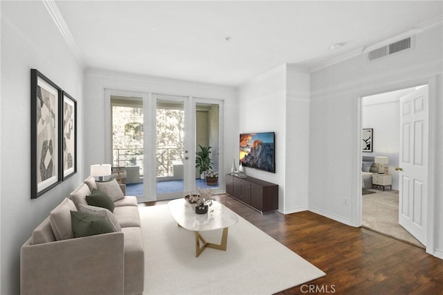 living room with dark hardwood / wood-style flooring and ornamental molding