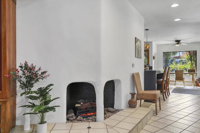 interior space featuring ceiling fan and light tile patterned floors