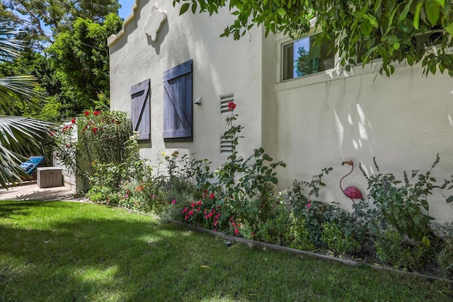 view of home's exterior featuring a yard