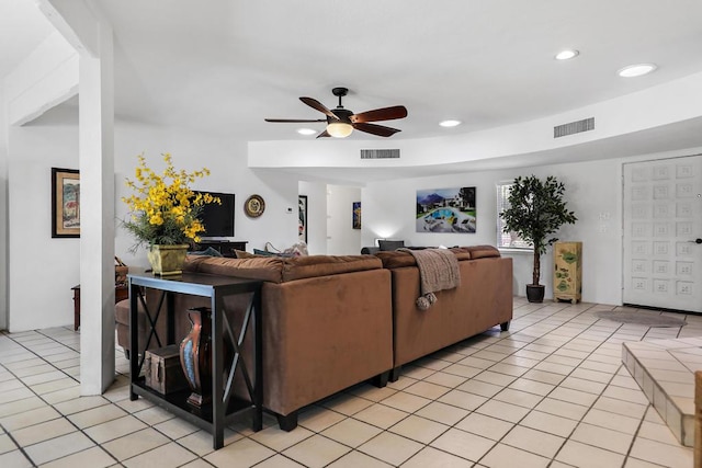 tiled living room with ceiling fan