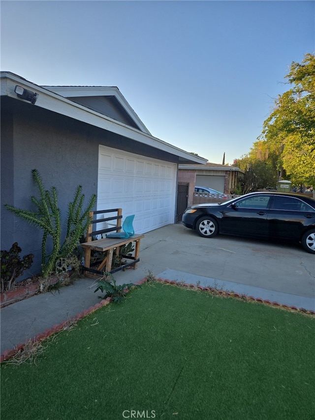 view of side of property with a garage