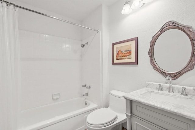 full bathroom with vanity, toilet, and tiled shower / bath combo