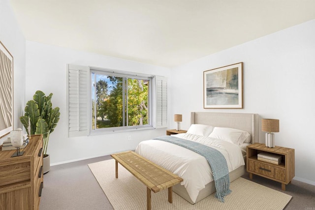 bedroom featuring dark colored carpet