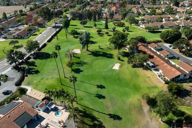 drone / aerial view with a residential view and golf course view