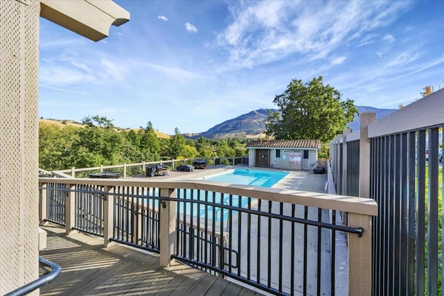 view of swimming pool featuring a mountain view