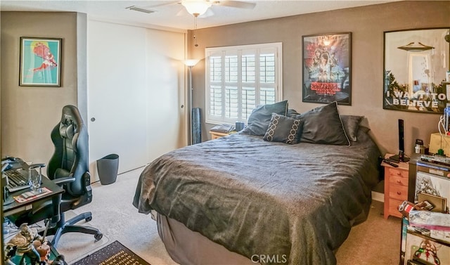 carpeted bedroom with ceiling fan