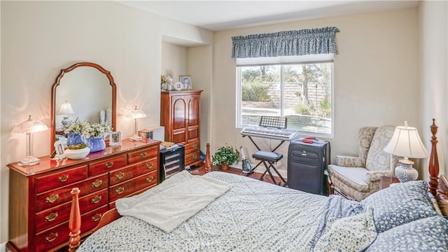 bedroom with hardwood / wood-style floors