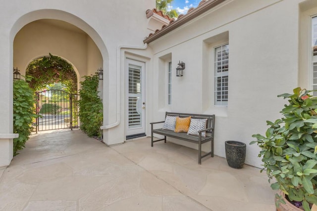 property entrance featuring a patio