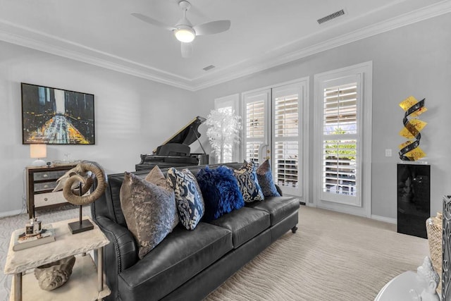 carpeted living room with ceiling fan and crown molding