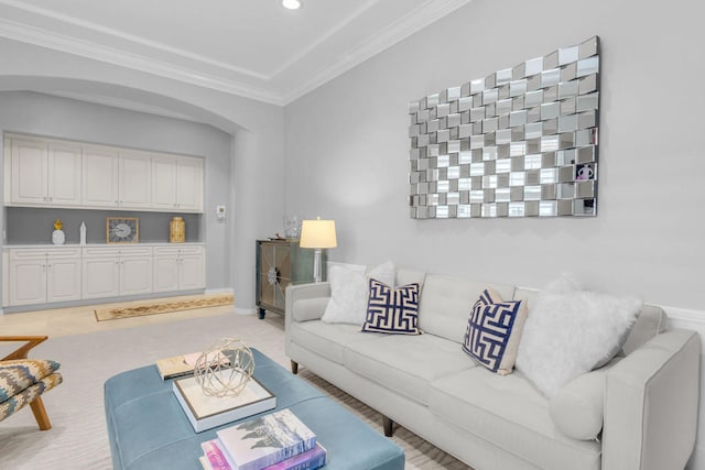 carpeted living room with crown molding