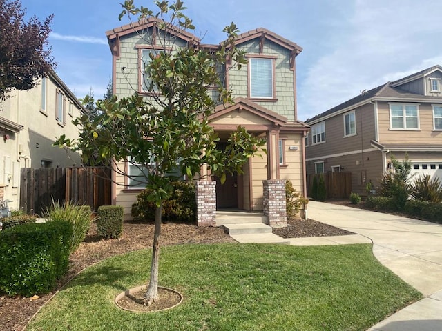 craftsman inspired home with a garage and a front yard