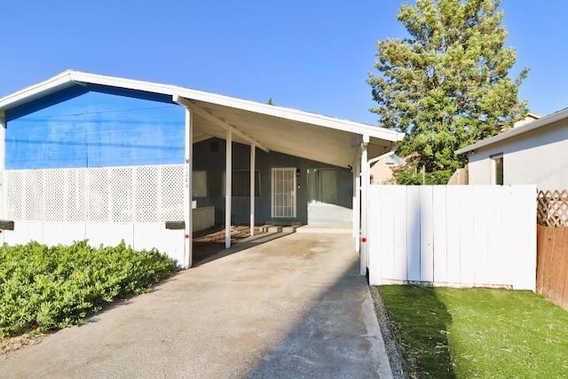 view of property exterior with a carport