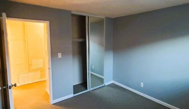 unfurnished bedroom featuring a closet