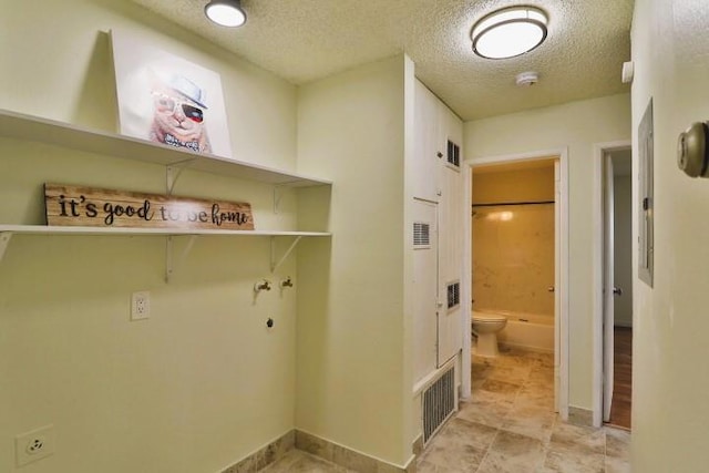 washroom featuring a textured ceiling