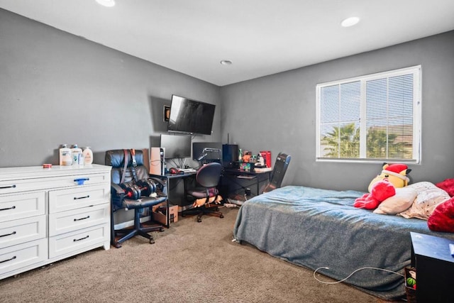 bedroom featuring light carpet