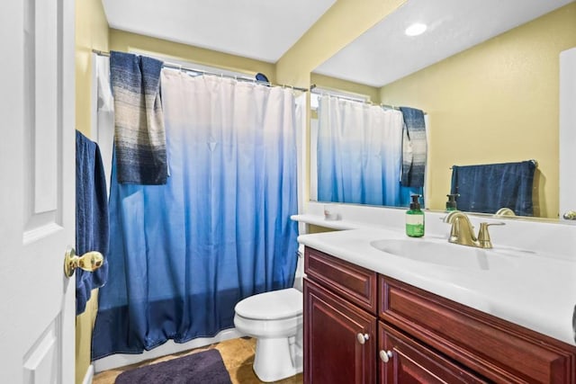 full bathroom with tile patterned floors, vanity, toilet, and shower / bath combo with shower curtain