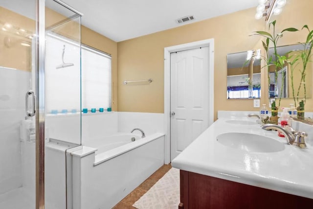 bathroom featuring separate shower and tub, tile patterned flooring, and vanity