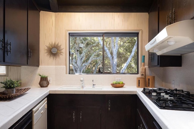 kitchen featuring dark brown cabinetry, black gas stovetop, and dishwasher