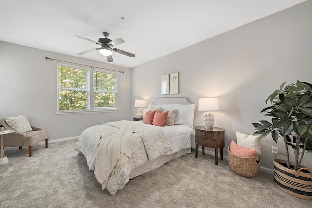 bedroom featuring light colored carpet and ceiling fan