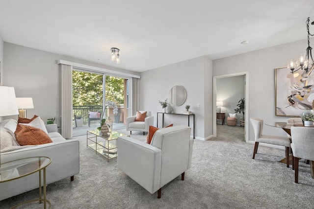 carpeted living room featuring a notable chandelier