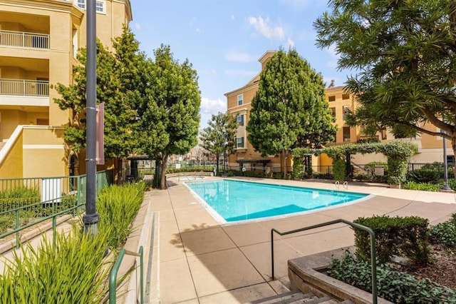 view of swimming pool with a patio area